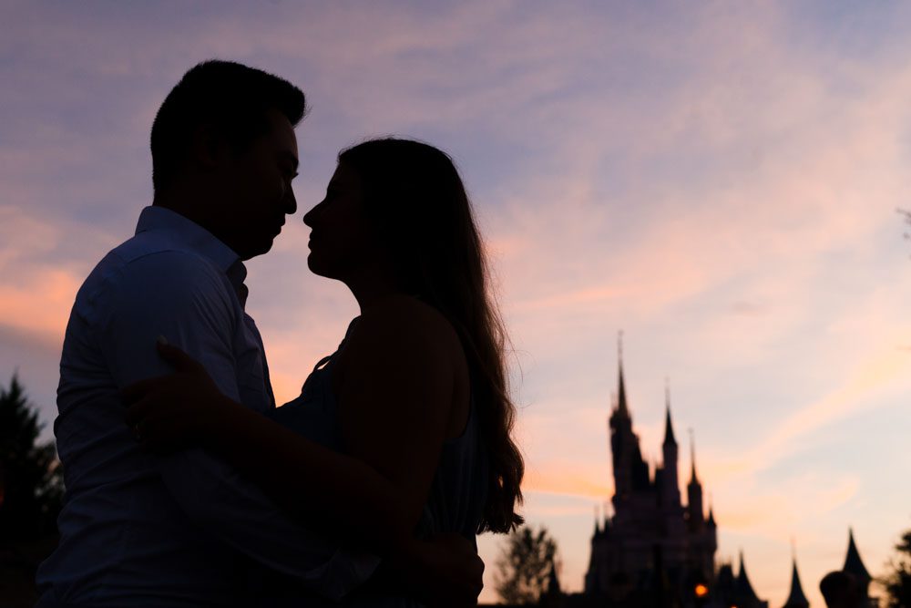 Sunset sky over Cinderella Castle in Magic Kingdom captured by Disney engagement photographer in Orlando