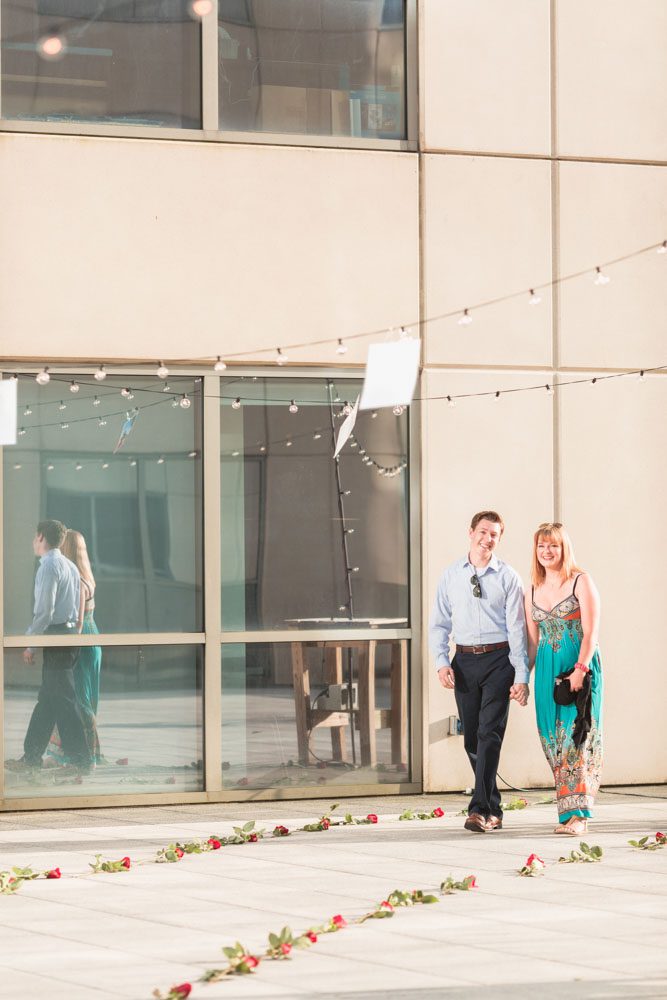 Romantic surprise proposal in Orlando at The Balcony captured by top engagement photographer