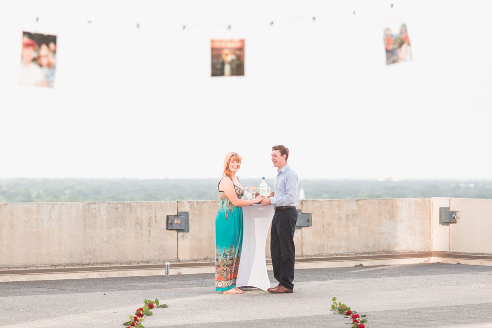 Orlando engagement photographer captures surprise proposal at The Balcony in downtown with skyline views at sunset