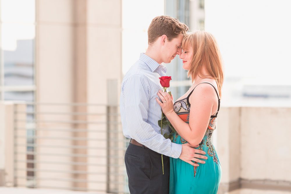 Romantic surprise proposal in Orlando at The Balcony captured by top engagement photographer