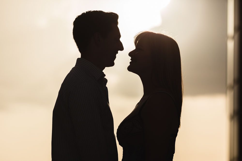 Silhouette at sunset at The Balcony rooftop venue in Orlando during an engagement photography session