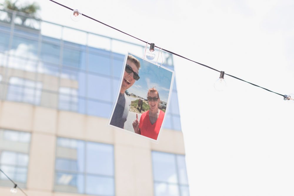 Orlando engagement photographer captures surprise proposal at The Balcony in downtown with skyline views at sunset