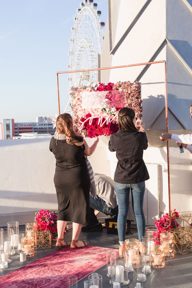 Custom sign and decorations made for a surprise proposal near ICON Orlando ferris wheel 