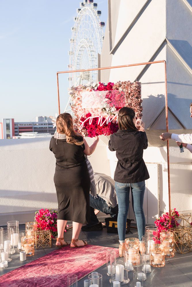 Custom sign and decorations made for a surprise proposal near ICON Orlando ferris wheel