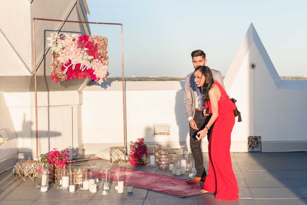 ICON Orlando eye ferris wheel in view during a rooftop proposal captured by top engagement photographer