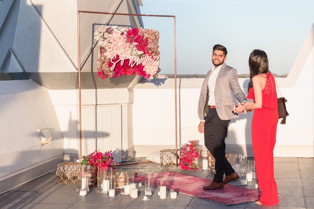 Surprise proposal in Orlando at The Castle Hotel rooftop captured by top Orlando engagement photographer