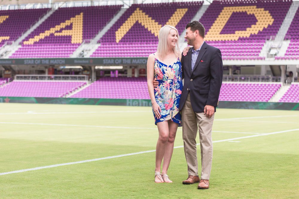 Orlando engagement photographer captures a surprise proposal on the field at the Orlando City Soccer Exploria stadium in downtown
