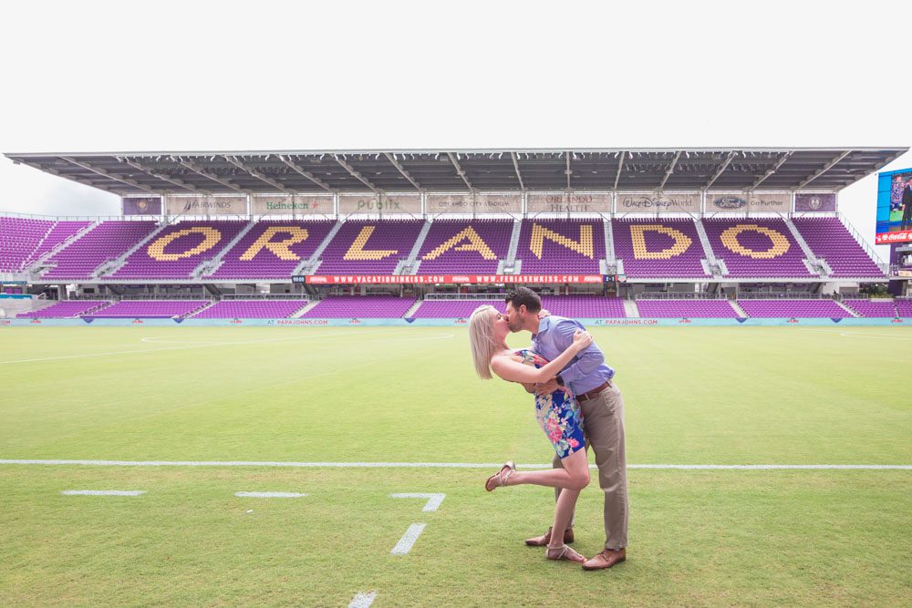 Orlando engagement photographer captures a surprise proposal on the field at the Orlando City Soccer Exploria stadium in downtown