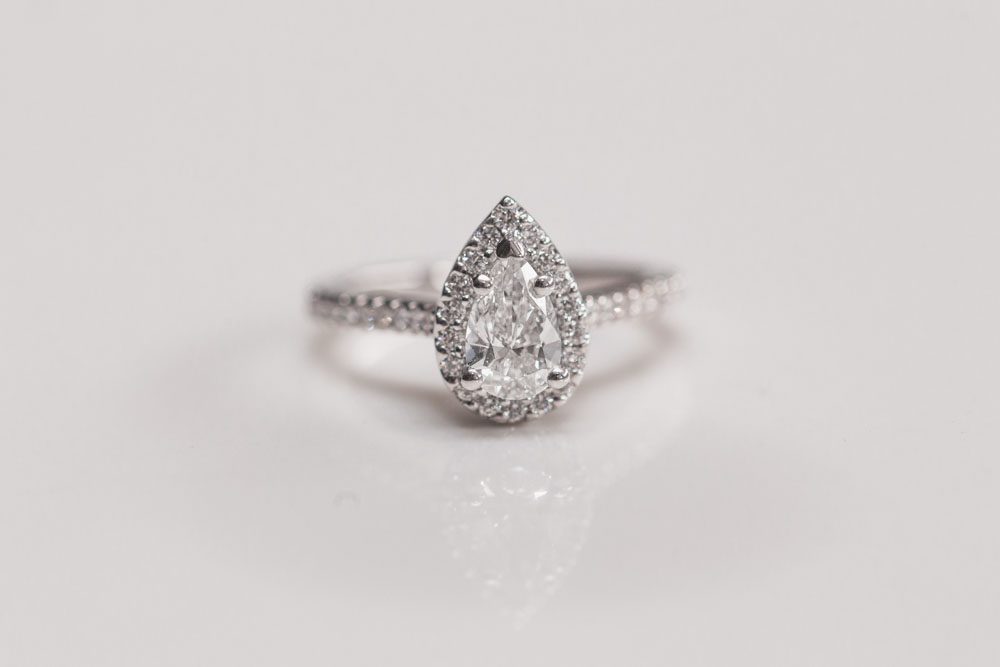 Close up of pear shaped engagement ring during a surprise proposal in Orlando