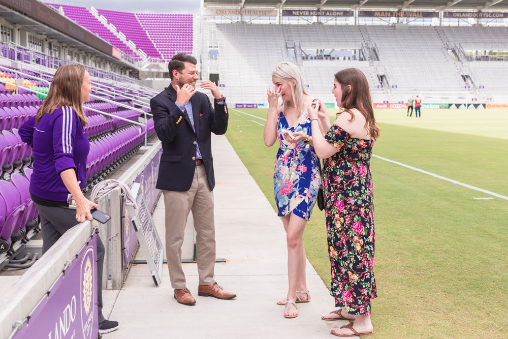 Orlando engagement photographer captures a surprise proposal on the field at the Orlando City Soccer Exploria stadium in downtown